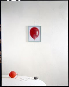 Balloon rock on table with painting 2010